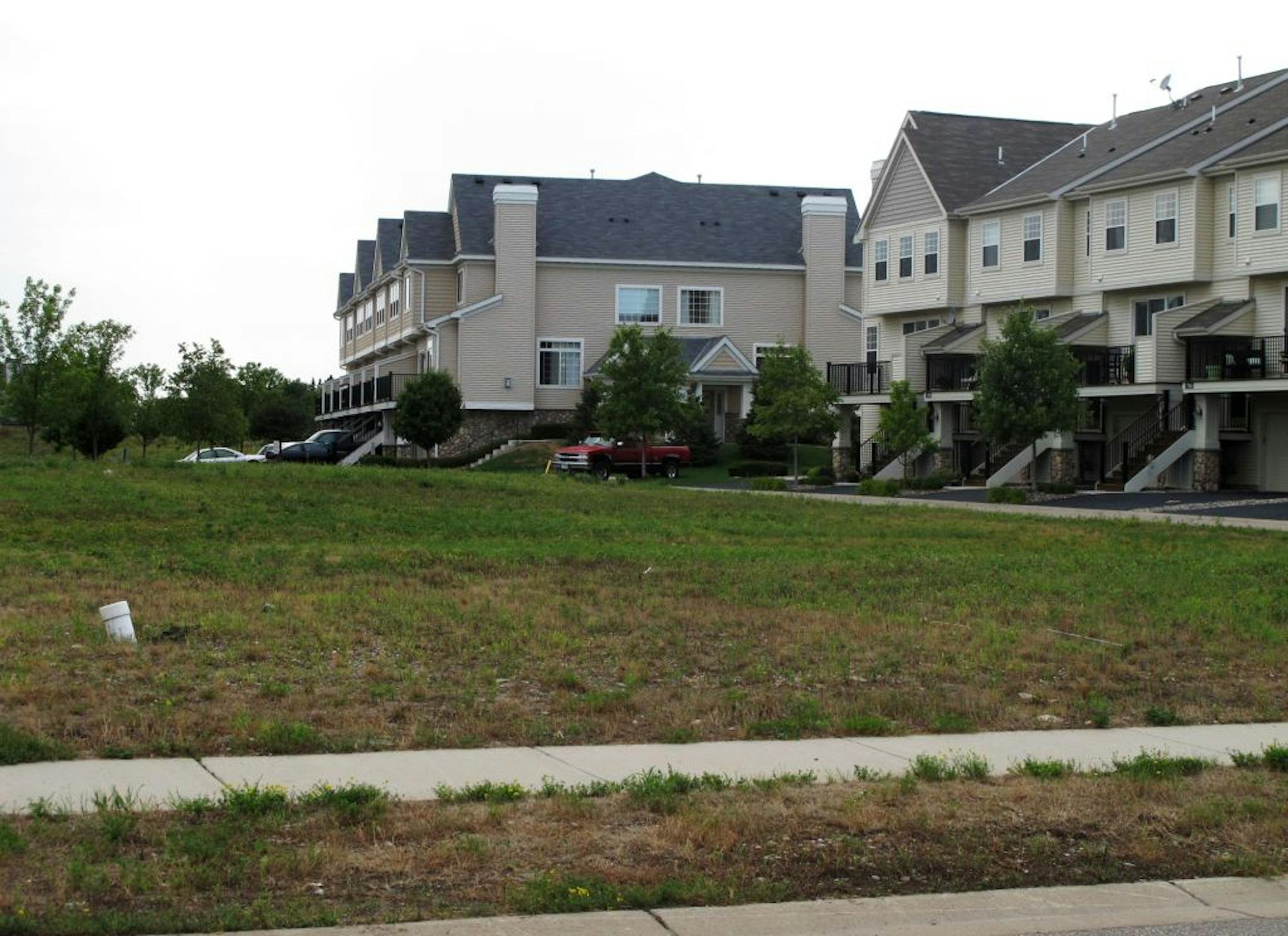 Photo by Susan Feyder The homeowners association of a nearby development purchased this adjacent lot, once valued at nearly $400,000, for about $40,000 recently and plans to keep it as green space. It was once owned by the now-defunct Rottlund Homes.