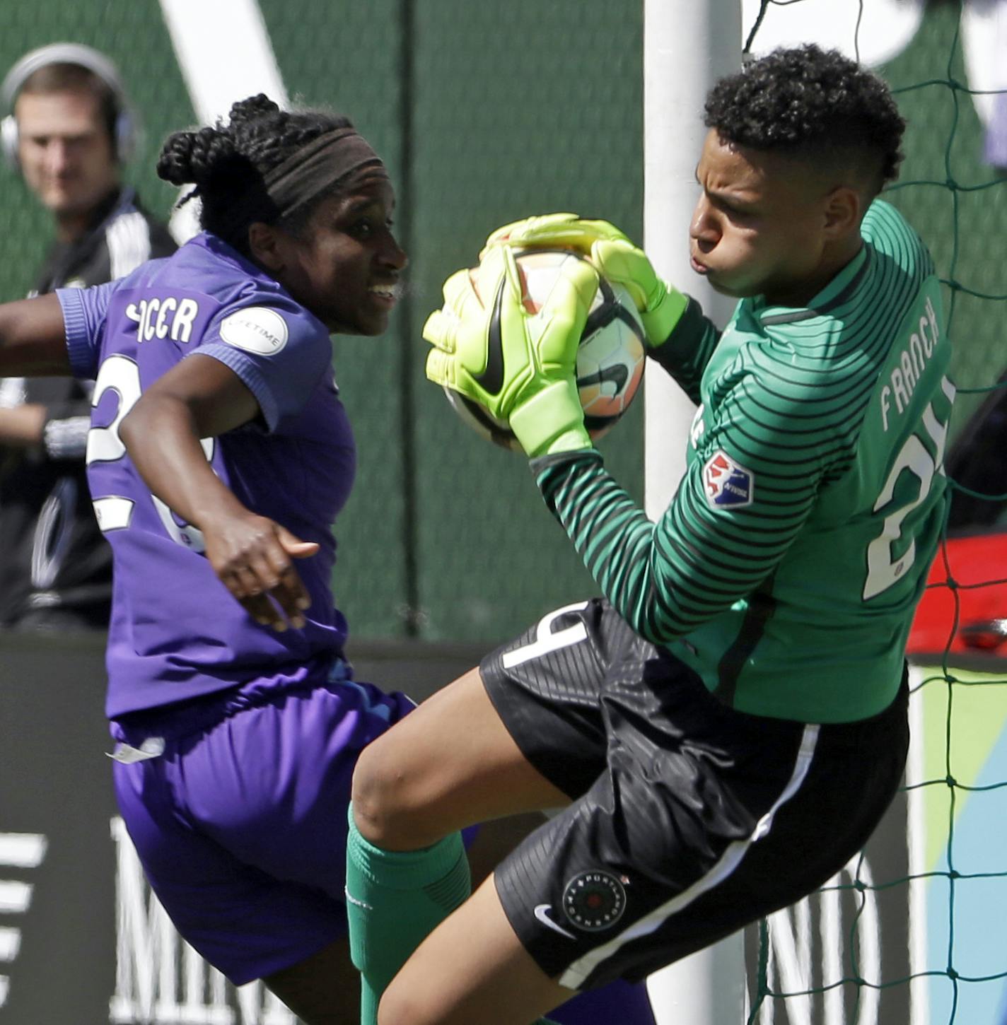 FILE - In this April 15, 2017, file photo, Portland Thorns goalie Adrianna Franch, right, stops a scoring attempt by Orlando Pride forward Jasmyne Spencer during the second half of their NWSL soccer match in Portland, Ore. The National Women&#xed;s Soccer league opens its sixth season this weekend. The defending champion Portland Thorns play the North Carolina Courage on Saturday, with both teams looking to build on last year&#xed;s success. (AP Photo/Don Ryan, File)