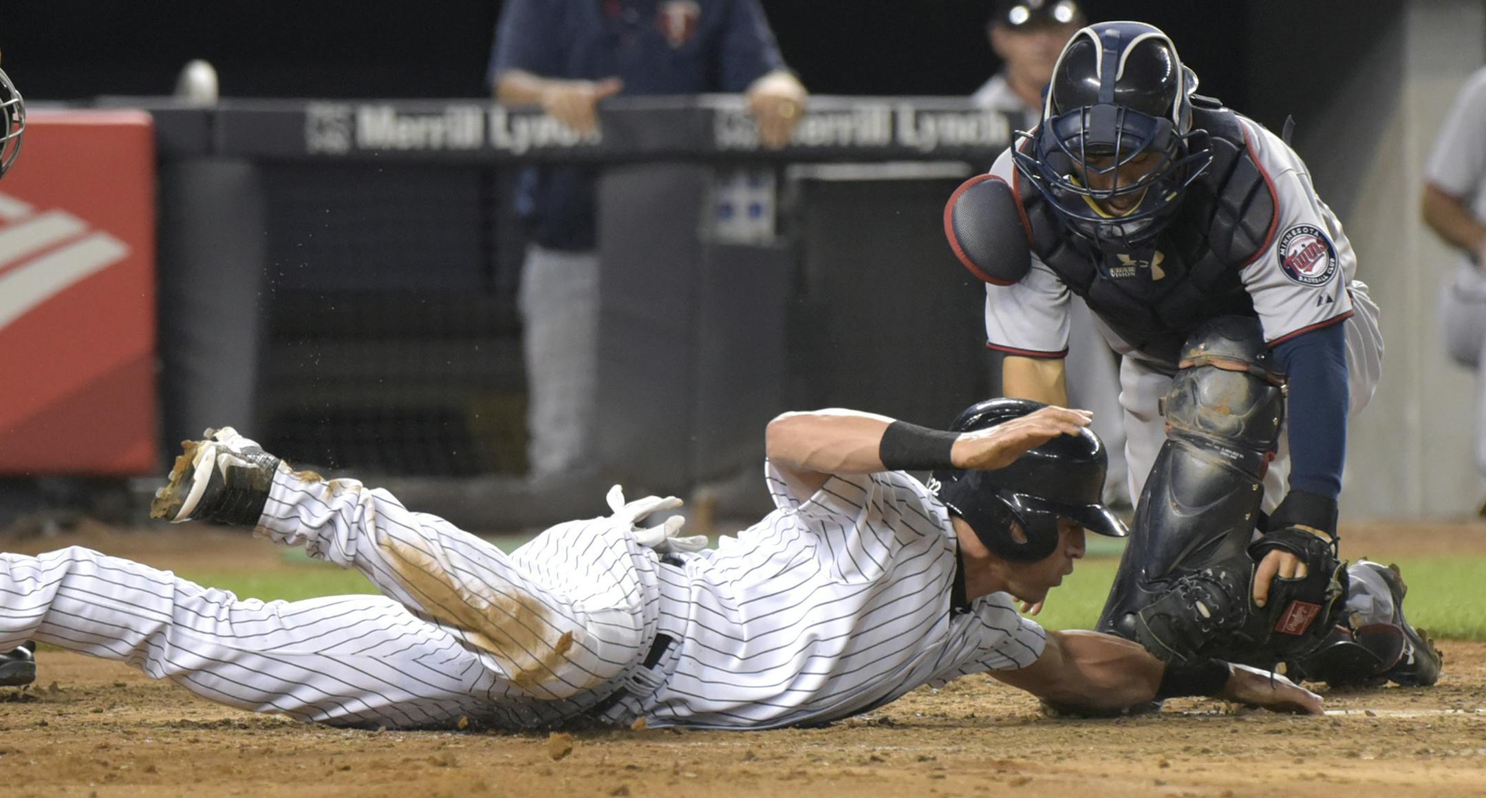 New York Yankees' Jacoby Ellsbury, left, is tagged out by Minnesota Twins catcher Kurt Suzuki attempting to score during the third inning of a baseball game Monday, Aug 17, 2015, at Yankee Stadium in New York. (AP Photo/Bill Kostroun)