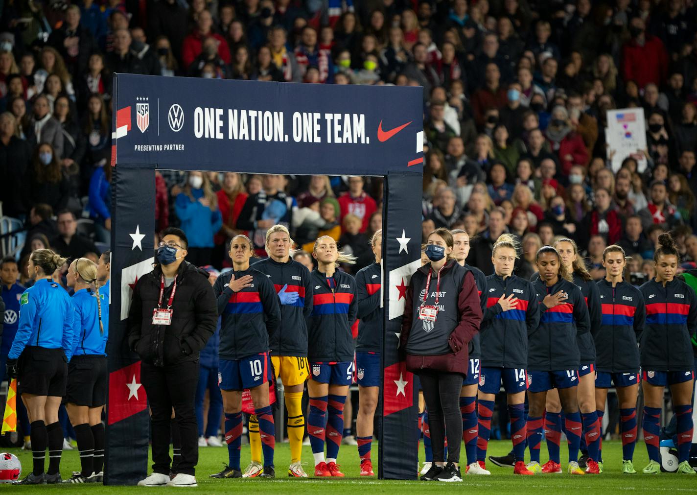 USWNT forward Carli Lloyd (10) stood with the rest of the team for the playing of the national anthem Tuesday