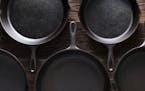 Cast Iron Skillets pans on Rustic Wood Table