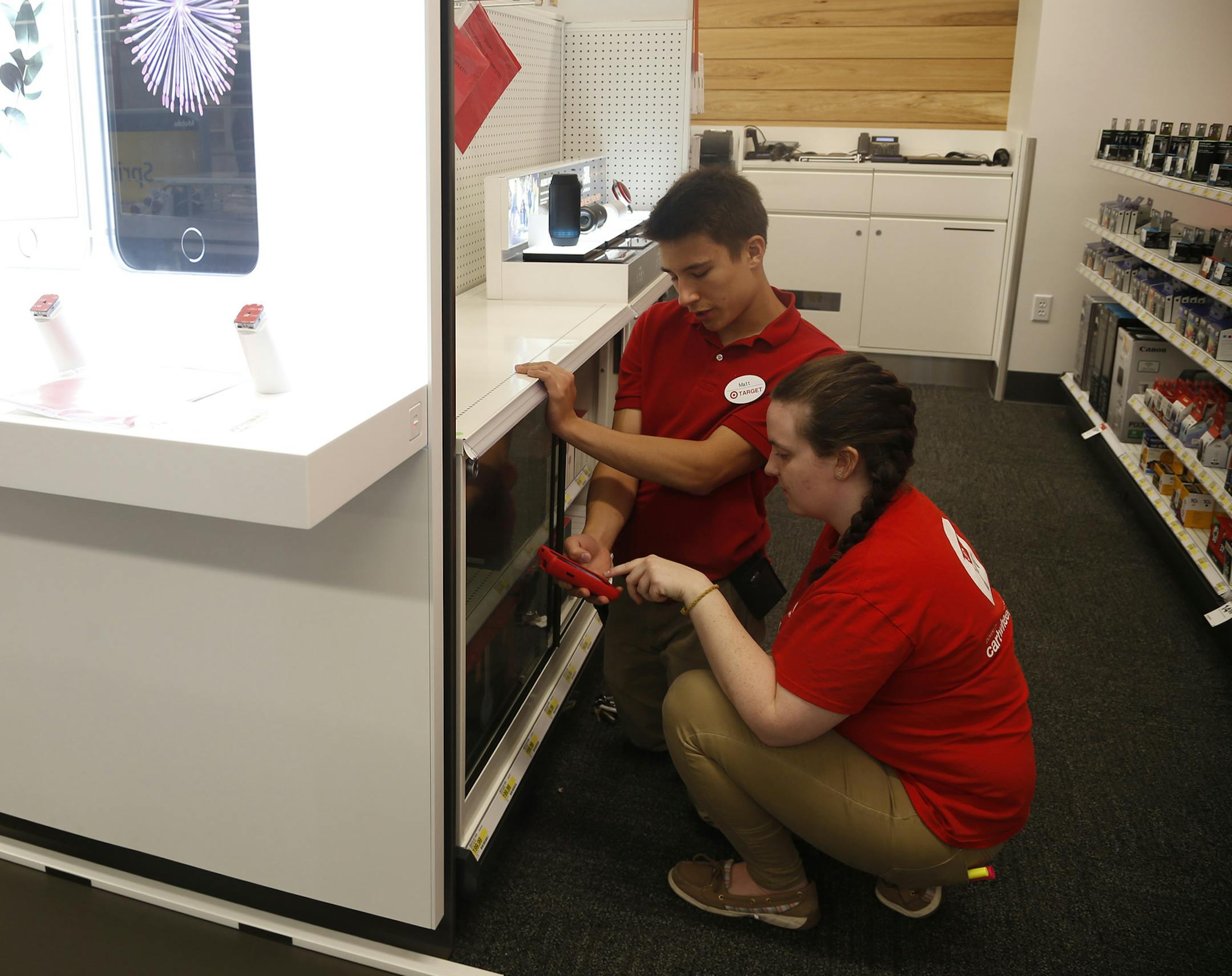 Matt Bluhm and Kate Dahl worked to get the electronics department ready.
