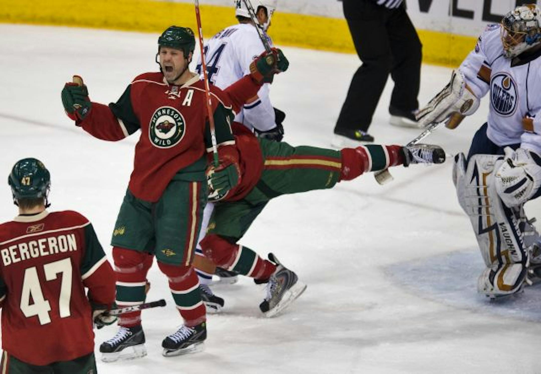 Owen Nolan celebrated his second-period goal against Edmonton goalie Dwayne Roloson, who couldn't help upsetting Dan Fritsche. Fritsche had the assist.