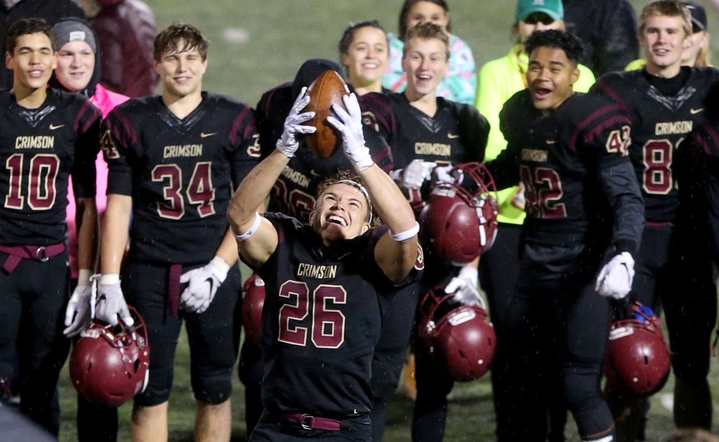 Following his team's 28-0 win over White Bear Lake, Maple Grove running back Evan Hull (26) spun around to the delight of teammates Friday, Oct. 26, 2018, at Maple Grove High in Maple Grove, MN.] DAVID JOLES &#xef; david.joles@startribune.com Class 6A football playoff game action, White Bear Lake at Maple Grove