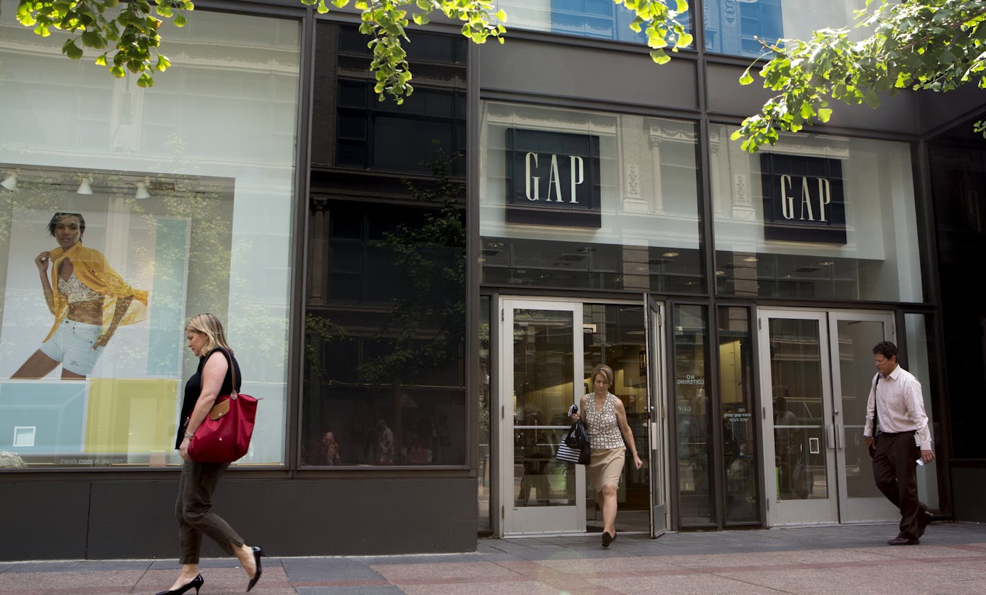 A shopper walks out of Gap at 7th and Nicollet Mall in Minneapolis, Minn., Monday, July 13, 2015. The IDS Center location of Gap is closing.] KAYLEE EVERLY kaylee.everly@startribune.com