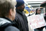 Greta Agiramahoro joined a contingent from the group Isaiah as they made their way off the Northstar commuter line at the Target Field Station on Thur