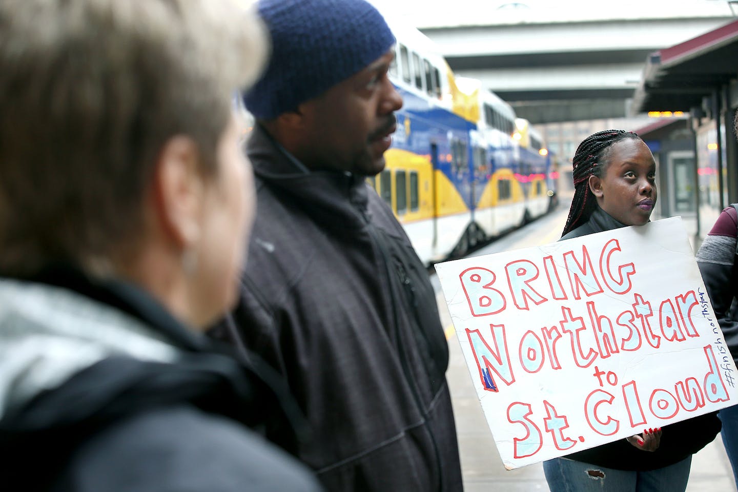 Greta Agiramahoro joined a contingent from the group Isaiah as they made their way off the Northstar commuter line at the Target Field Station on Thursday.