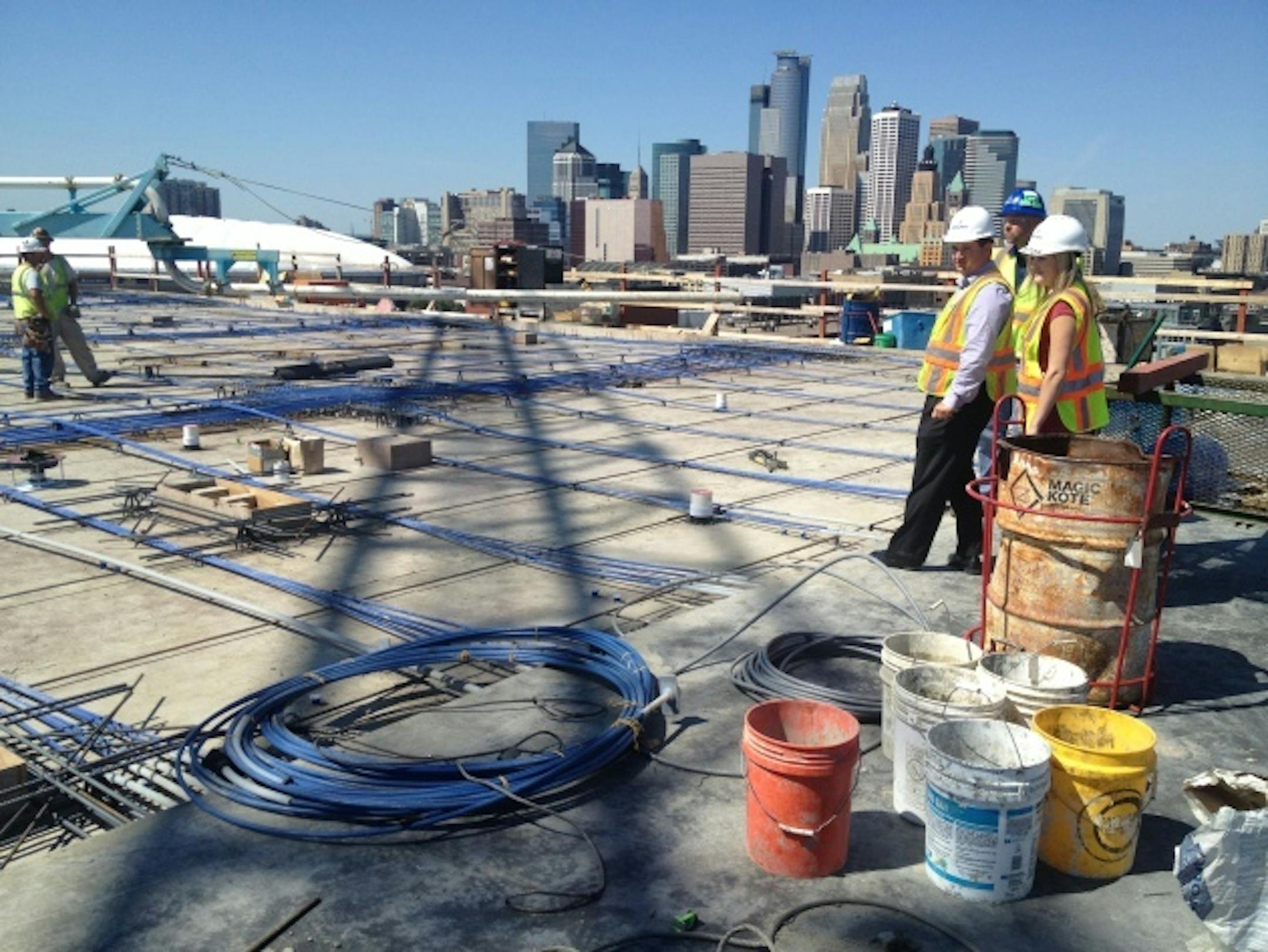 Star Tribune photo by Jim Buchta During the topping-off cere­mony, two officers of the St. Paul Area Association of Realtors, communications director Kim Broback, right, and government affairs director and Eric Myers, left, got a skyline tour from Jeff Walker, site superintendent for JE Dunn Construction Co.