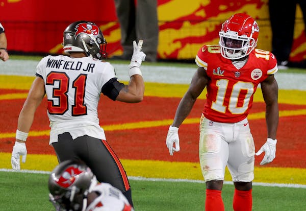 Antoine Winfield Jr. #31 of the Tampa Bay Buccaneers taunts Tyreek Hill #10 of the Kansas City Chiefs during the fourth quarter in Super Bowl LV at Ra
