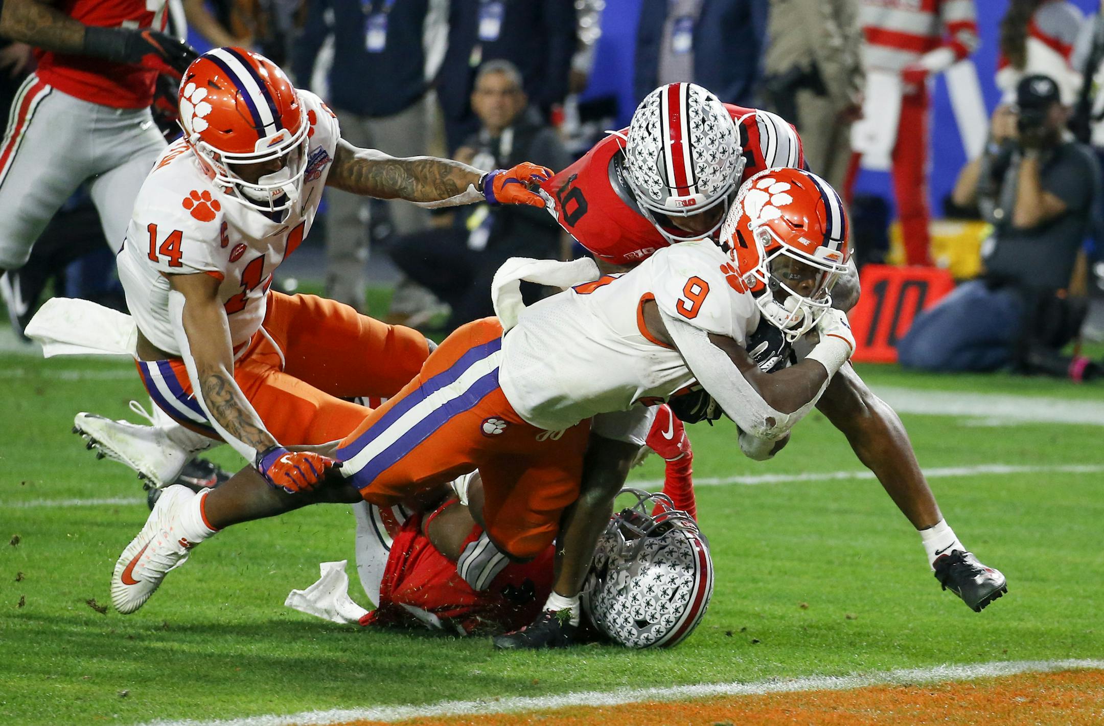 Clemson running back Travis Etienne scores against Ohio State during the second half of the Fiesta Bowl NCAA college football playoff semifinal Saturday, Dec. 28, 2019, in Glendale, Ariz. (AP Photo/Ross D. Franklin)