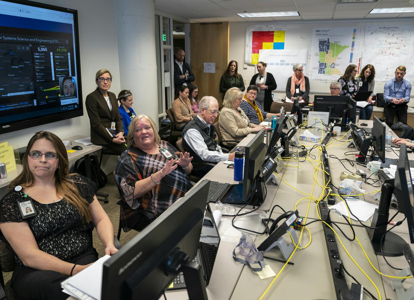 Deb Hulbert, second from left, director of employee assistance program and employee occupational health and safety, spoke during a meeting of Allina's COVID-19 incident command team.