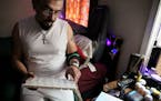 Greg Sanchez, who has been living with HIV for 30 years, displays his many medications stored in the bedroom of his Chicago home on Wednesday, June 3,