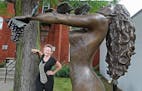 Deb Zeller stood near her bronze sculpture "Goddess of the Grapes," Tuesday, July 28, 2015 in Hopkins, MN. The sculpture is one of six recently-instal