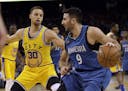 Minnesota Timberwolves' Ricky Rubio (9) during an NBA basketball game against the Golden State Warriors' Stephen Curry Tuesday, April 5, 2016, in Oakl