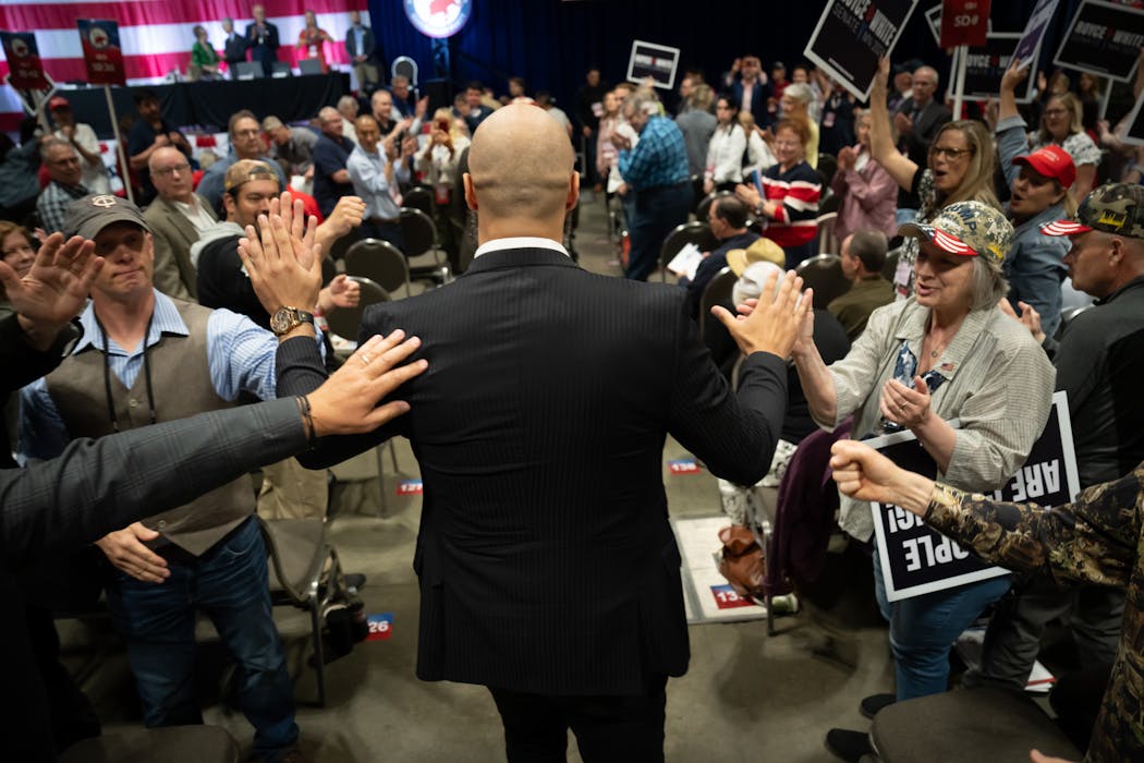Royce White high fives supporters at the GOP convention after winning the party's endorsement to run against Amy Klobuchar.  He won the endorsement with 67% of the vote on the first ballot against Joe Fraser. 