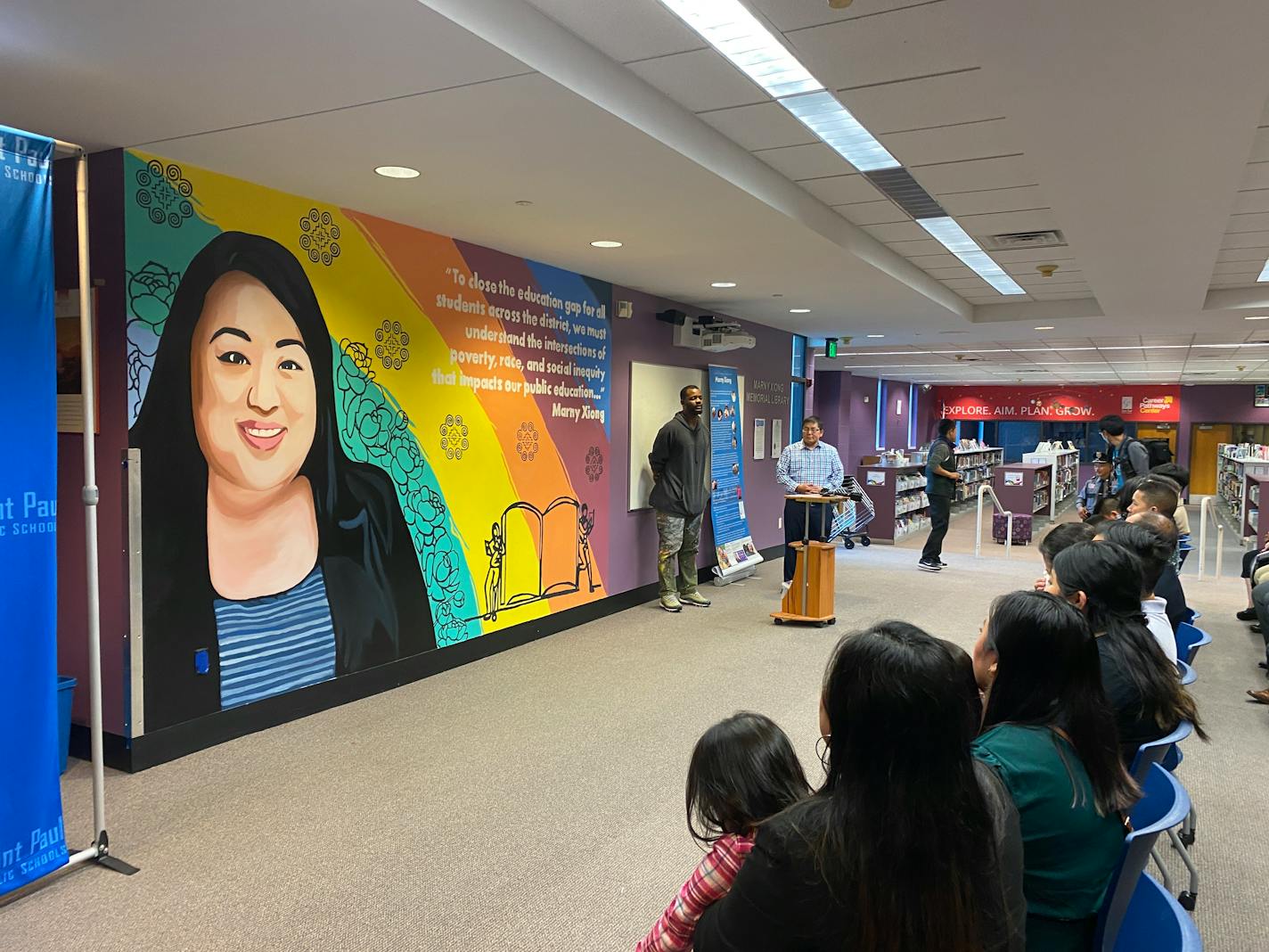 A new mural at Washington Technology Magnet School, formerly Arlington High, shows Marny Xiong, the late St. Paul school board chair who died of COVID-19 at age 31. The mural by artist Mwene Kajunju was unveiled at the dedication of a memorial library at the school where she graduated. (Photo provided by St. Paul Public Schools)