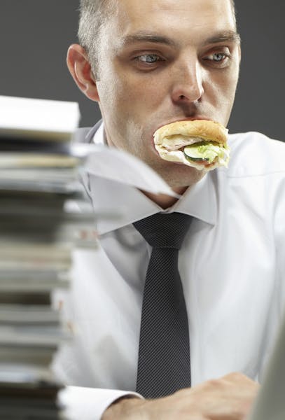 Eating at your desk illustration, istock
