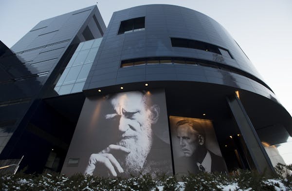 The north side of the Guthrie Theater, with the faces of George Bernard Shaw, left, and Eugene O'Neil, is pictured Wednesday night. ] (Aaron Lavinsky 