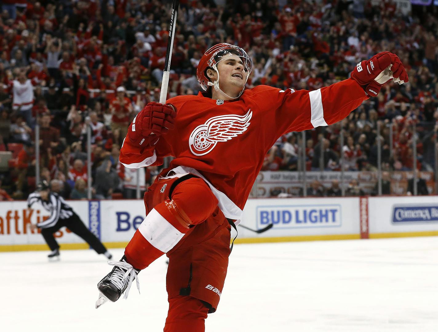 Detroit Red Wings center Dylan Larkin celebrates his goal against the New York Islanders in the third period of an NHL hockey game, Saturday, Feb. 6, 2016 in Detroit. (AP Photo/Paul Sancya)