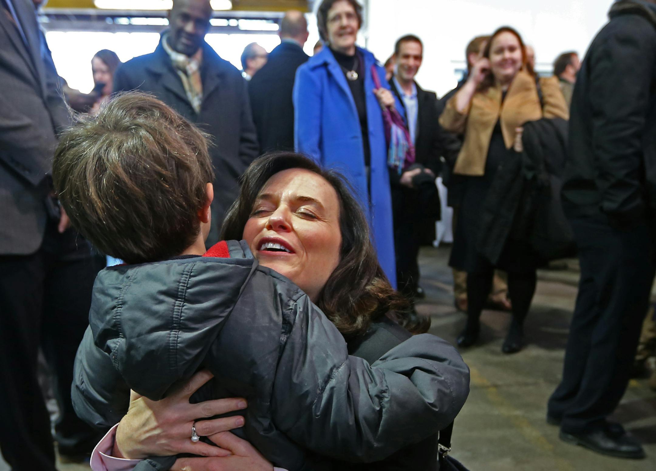 Betsy Hodges hugged Ravi Elliott, age 6 of Minneapolis before her first swearing in ceremony started at the Thorp building in North Minneapolis on 1/2/14. Ravi is the son of Brian Elliott, of Minneapolis. Several hundred friends, family and supporters attended the ceremony. Hodges' formal swearing in (where she will give her inaugural speech) is Monday, Jan. 6. Under city charter, she is required to be sworn in on the first business day of January, which is Jan. 2.] Bruce Bisping/Star Tribune bb