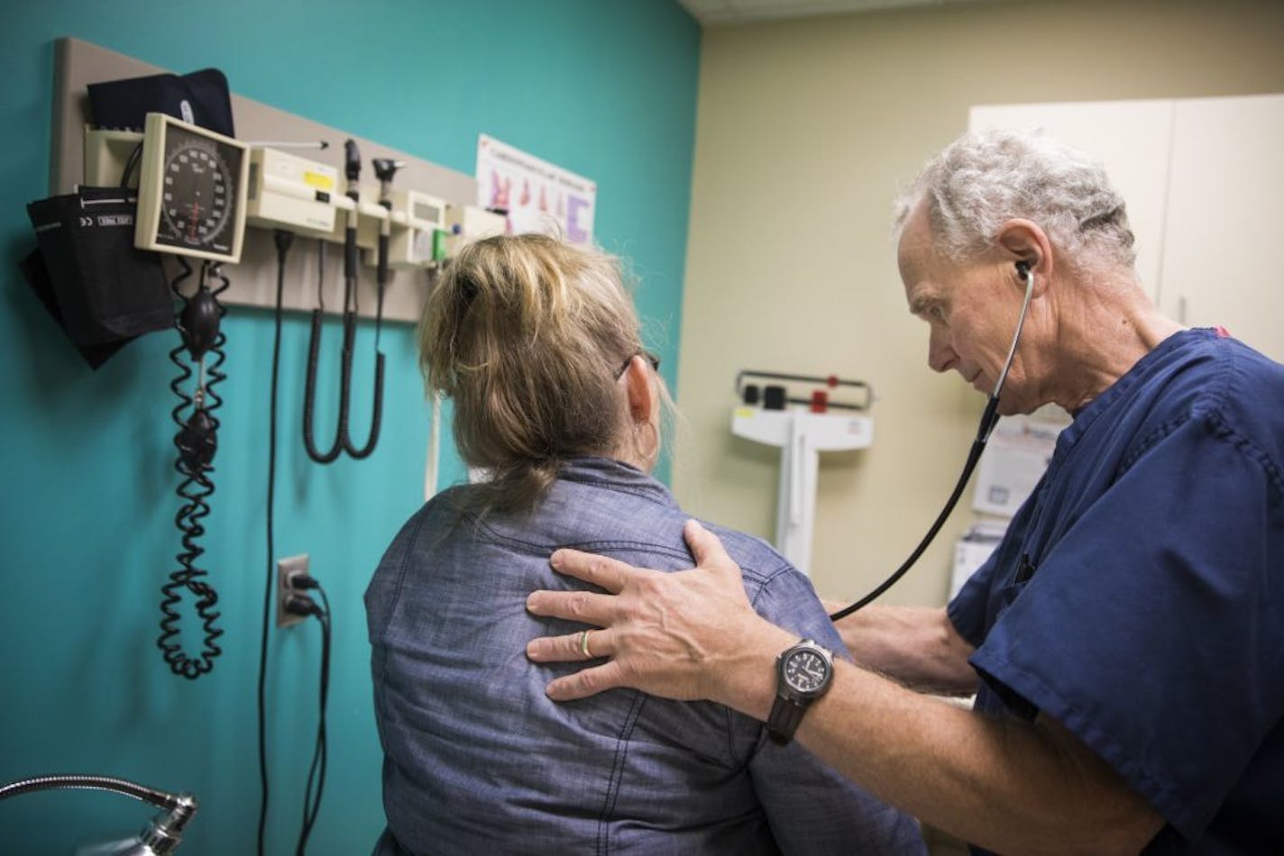 Dr. Michael Kamp examines a patient Thursday at Open Cities Medical Center. The low-income clinic in St. Paul would face major funding losses under the Graham-Cassidy health care proposal.