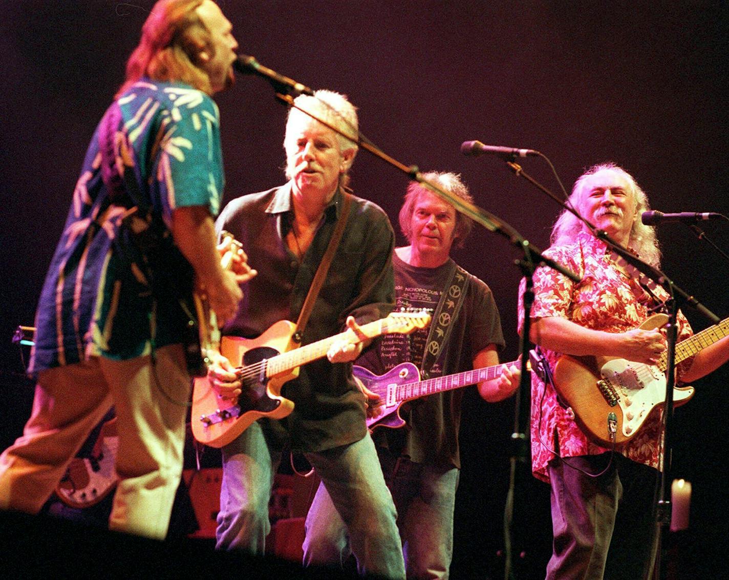 FILE - Legendary rockers Crobsy, Stills, Nash &amp; Young, from left, Stephen Stills, Graham Nash, Neil Young and David Crosby, perform at Reunion Arena, Tuesday, March 7, 2000, in Dallas. Crosby, the brash rock musician who evolved from a baby-faced harmony singer with the Byrds to a mustachioed hippie superstar and an ongoing troubadour in Crosby, Stills, Nash &amp; (sometimes) Young, has died at age 81. His death was reported Thursday, Jan. 19, 2023, by multiple outlets. (Samuel Morales/Star-Telegram via AP, File)