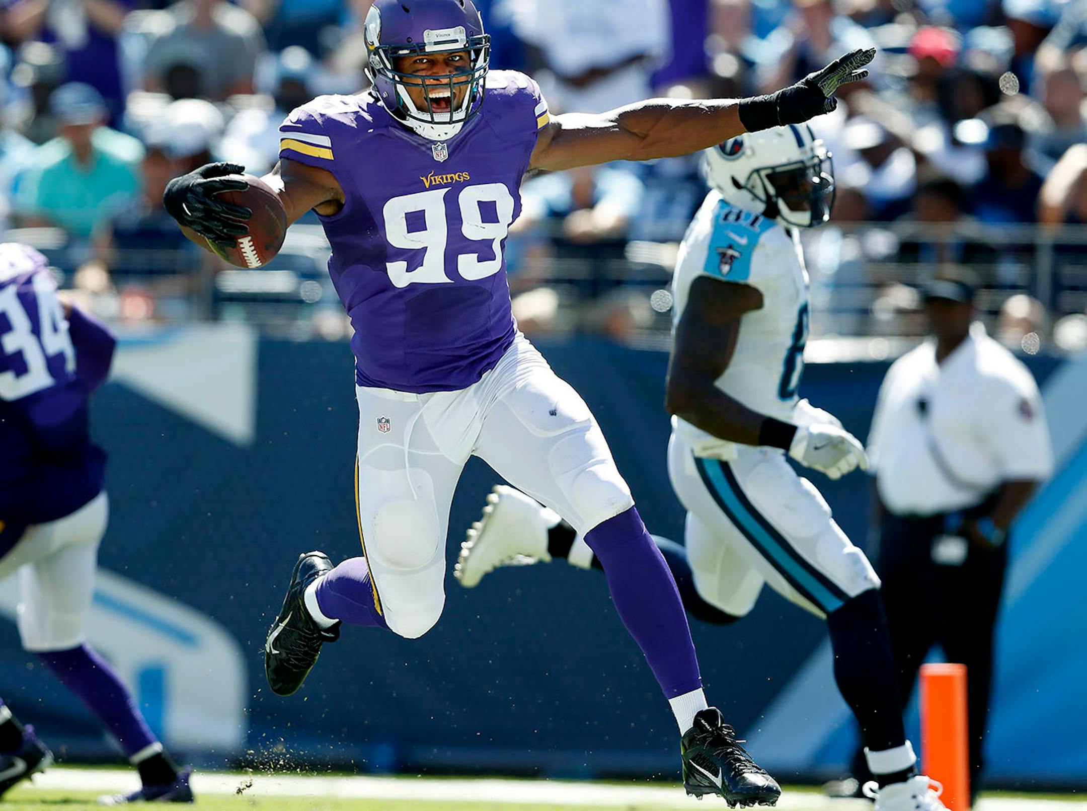 Danielle Hunter (99) celebrated after returning a fumble 24 yards for a touchdown in the fourth quarter.