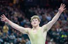 Waconia wrestler Max McEnelly celebrates after defeating Stillwater wrestler Ryder Rogotzke in the Class 3A 195lb weight class to win his fourth state