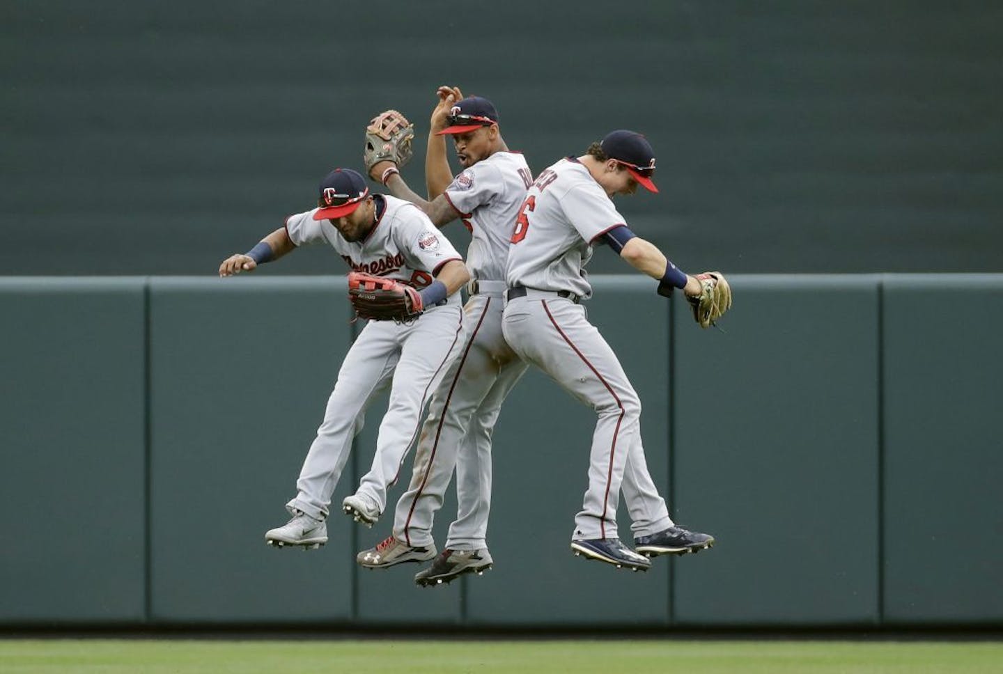 Minnesota Twins outfielders Eddie Rosario, from left, Byron Buxton and Max Kepler celebrate after a baseball game against the Baltimore Orioles in Baltimore, Wednesday, May 24, 2017. Minnesota won 4-3.