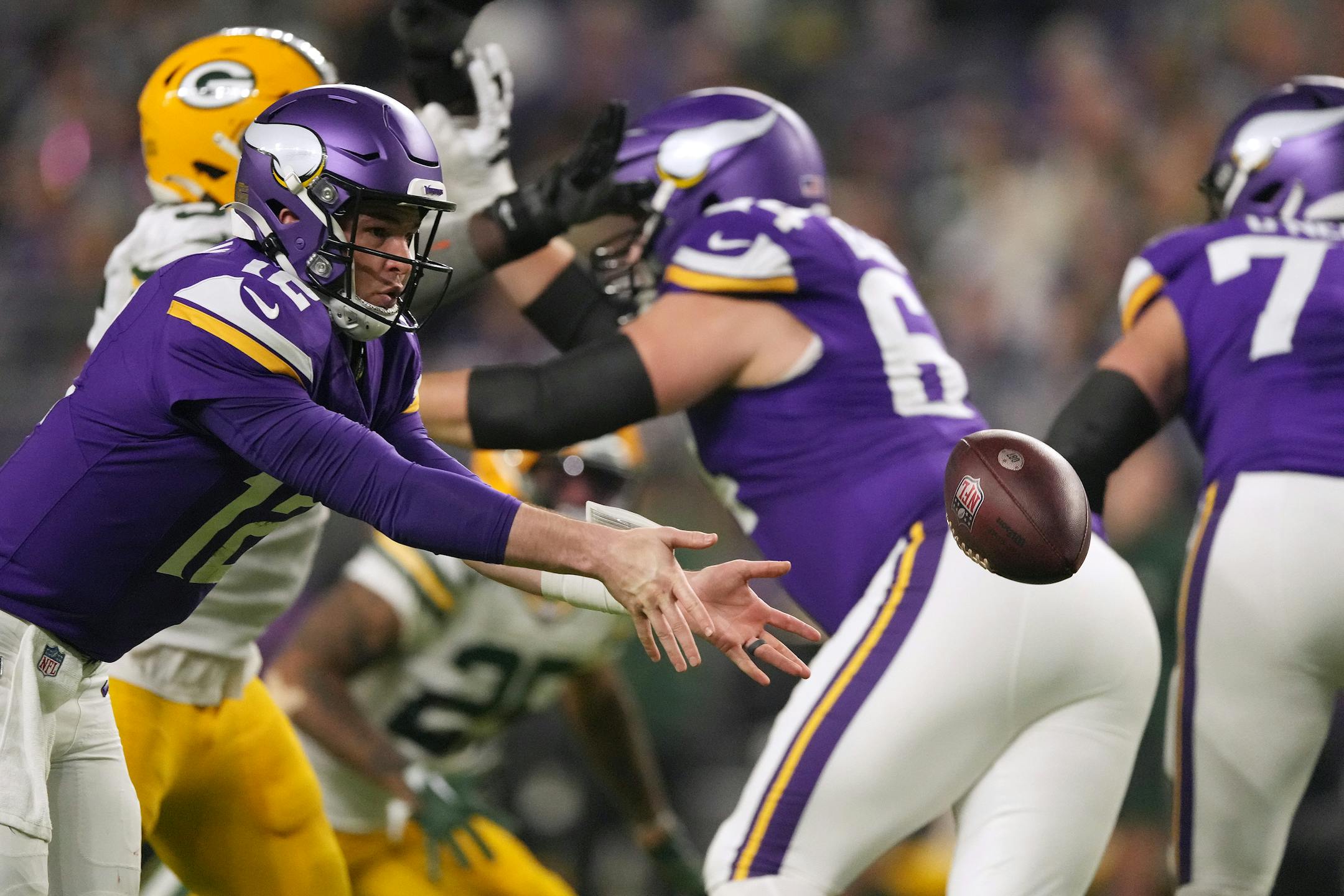 Minnesota Vikings quarterback Nick Mullens (12) pitches the ball back in the third quarter of an NFL game between the Minnesota Vikings and the Green Bay Packers Sunday, Dec. 31, 2023 at U.S. Bank Stadium in Minneapolis. ] ANTHONY SOUFFLE • anthony.souffle@startribune.com
