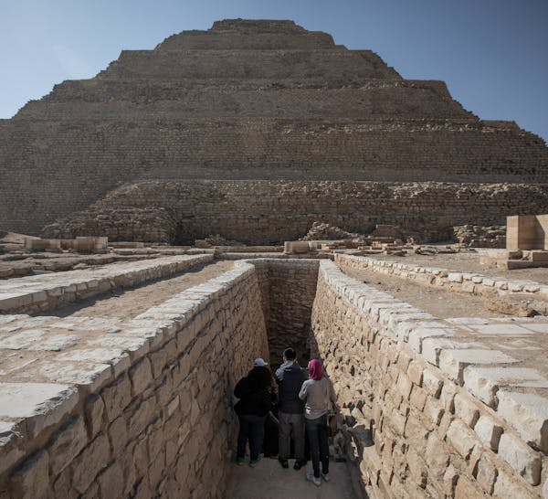 People enter the Pyramid of Djoser in Saqqara outside Cairo on March 5, 2020. Also know as the Step Pyramid, the believed world's earliest stone struc