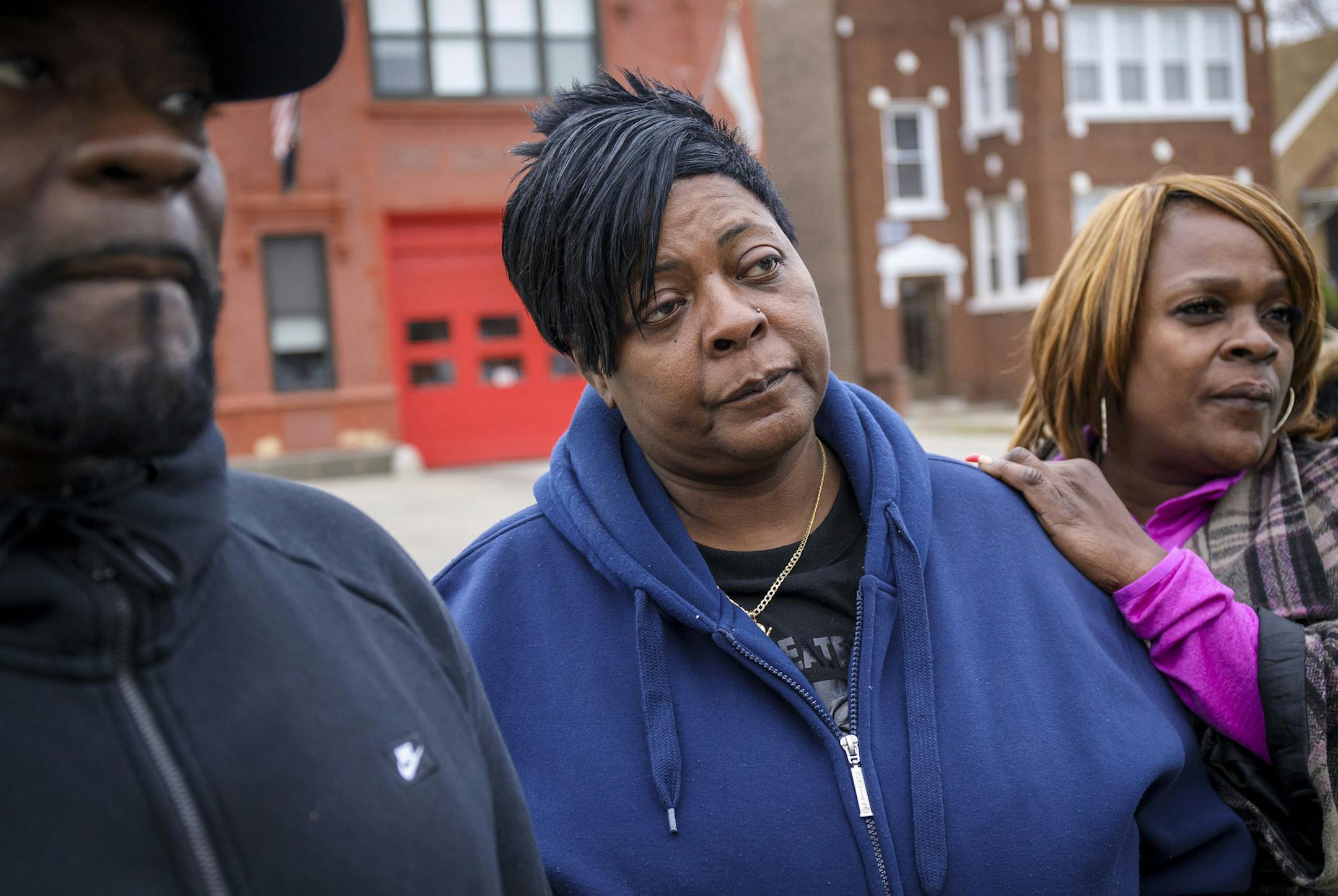 Valerie Weaver, center, the mother of Wilteeah Jones, gathers with her brother Donnie Weaver and friend Glenda Jones, to remember her daughter Thursday, Feb. 23, 2017 outside their family home in Auburn Gresham. (Brian Cassella/Chicago Tribune/TNS)