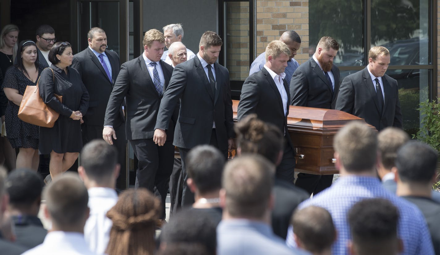 Vikings offensive linemen carry the casket of offensive line coach, Tony Sparano after his funeral was held at St. Bartholomew Catholic Faith Community Church Friday July 27, 2018 in Wayzata, MN. Sparano's family including his wife Jeanette M. Sparano walked behind the casket .] JERRY HOLT &#xef; jerry.holt@startribune.com