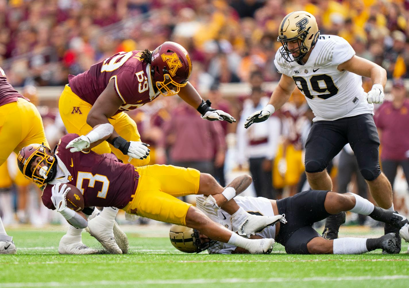 Gophers running back Trey Potts (3) was tackled by Purdue cornerback Bryce Hampton in the first quarter Saturday at Huntington Bank Stadium.