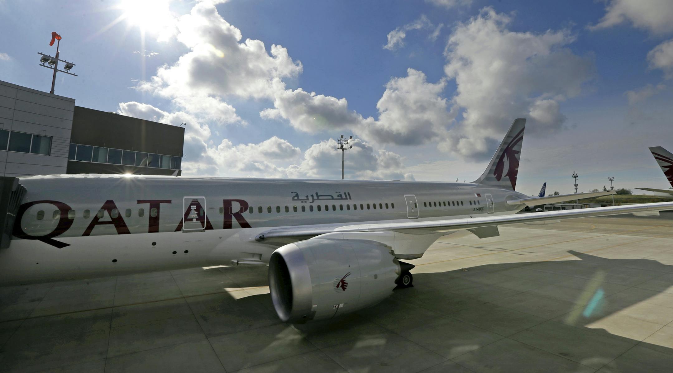 FILE - In this Wednesday, Nov. 4, 2015 file photo, the 24th Boeing 787 airplane purchased by Qatar Airways is photographed, during a delivery ceremony in Everett, Wash. FIFA has signed up Qatar Airways as a sponsor through 2022 when the World Cup is staged in the Gulf nation. (AP Photo/Ted S. Warren, File)