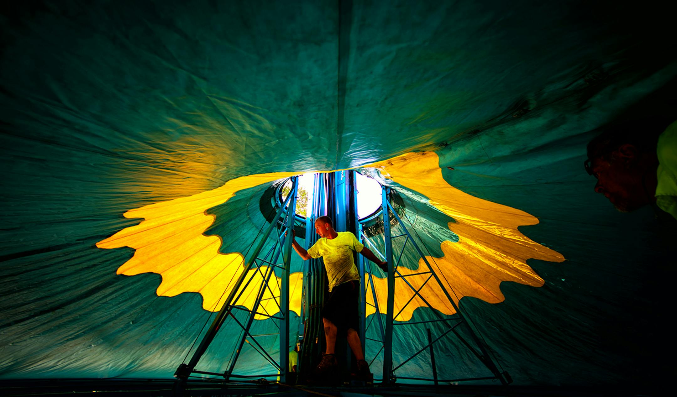 Stoney Adcock from Myers Entertainment helped raise the roof of the Wave Swinger ride at the Fair. The opening of the 2014 Minnesota State Fair is less than a week away and the place is hopping. ] Thursday, August 14, 2014. GLEN STUBBE * gstubbe@startribune.com