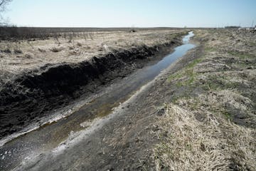 The ditch was dug and trees uprooted through Terry Lange’s property and wetland, where he hunted as a kid.