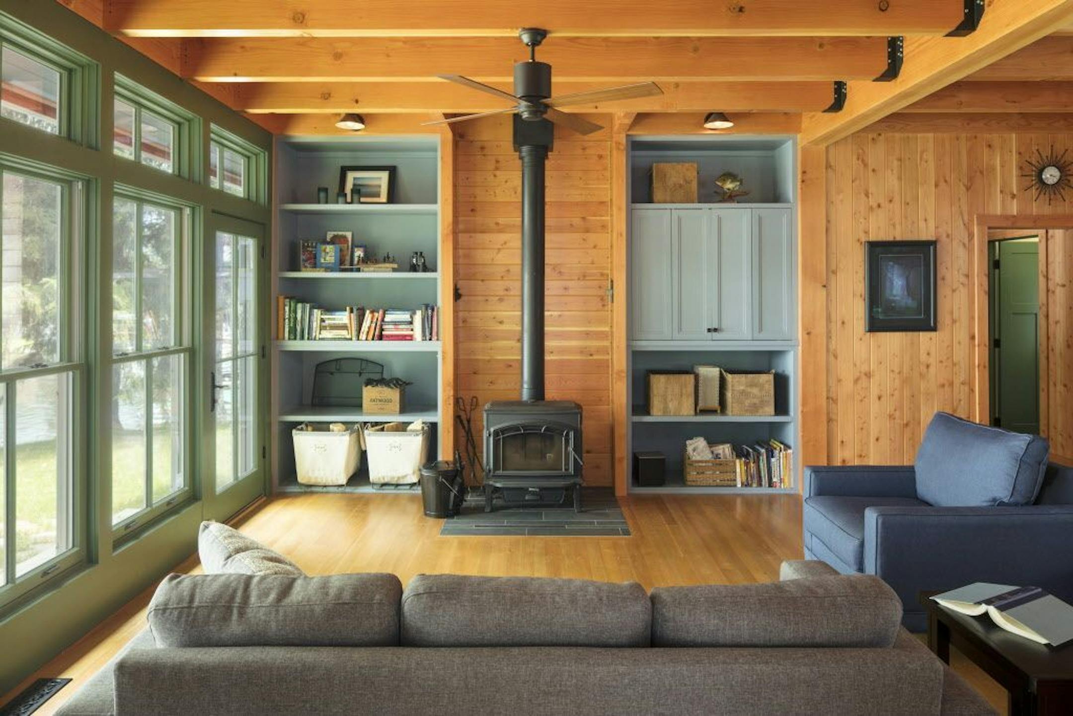 A blue and green palette balances the warm Douglas fir in this Wisconsin cabin, by Mark Larson, Rehkamp Larson Architects.