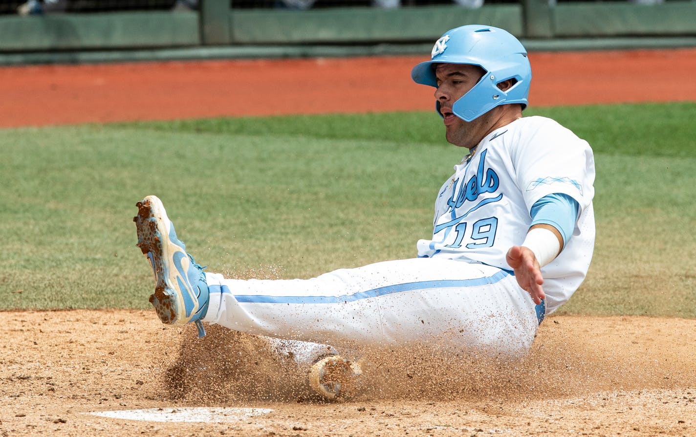 North Carolina's Aaron Sabato (19) scores a run against Auburn during Game 1 at the NCAA college baseball super regional tournament in Chapel Hill, N.C., Saturday, Jun 8, 2019.