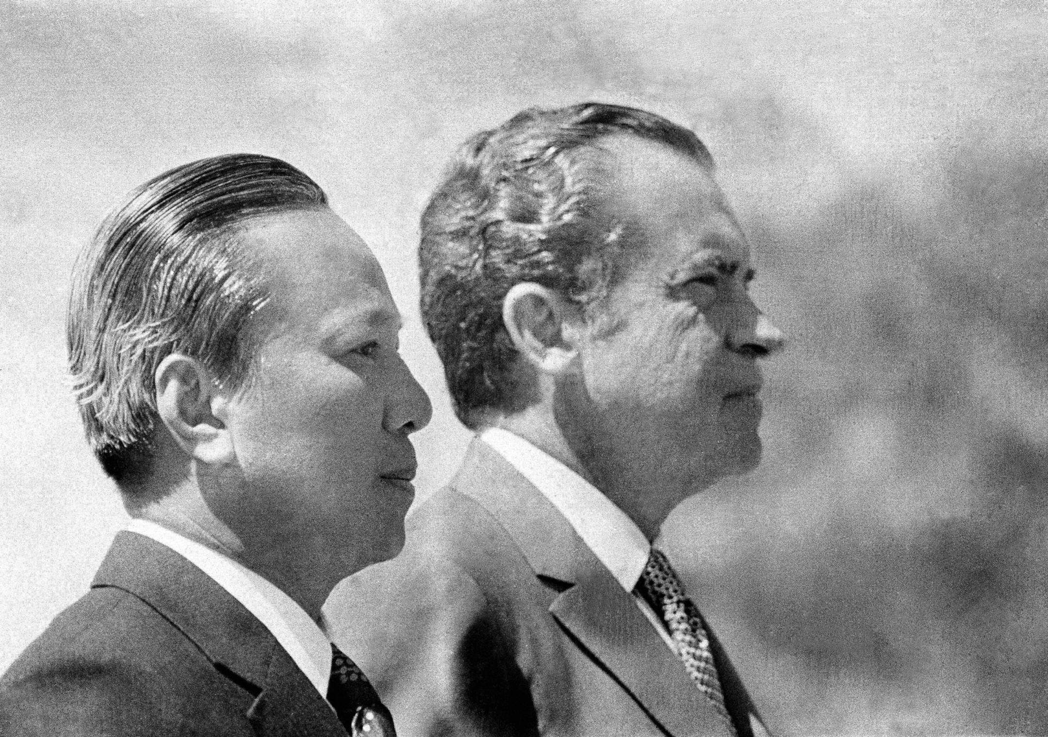 In this April 2, 1973 photo, President Richard Nixon and South Vietnamese President Nguyen Van Thieu are in profile as they listen to national anthems during arrival ceremonies for Thieu at the Western White House in San Clemente, Calif. As the last U.S. combat troops left Vietnam 40 years ago, angry protesters still awaited them at home. North Vietnamese soldiers took heart from their foes' departure, and South Vietnamese who had helped the Americans feared for the future. While the fall of Sai