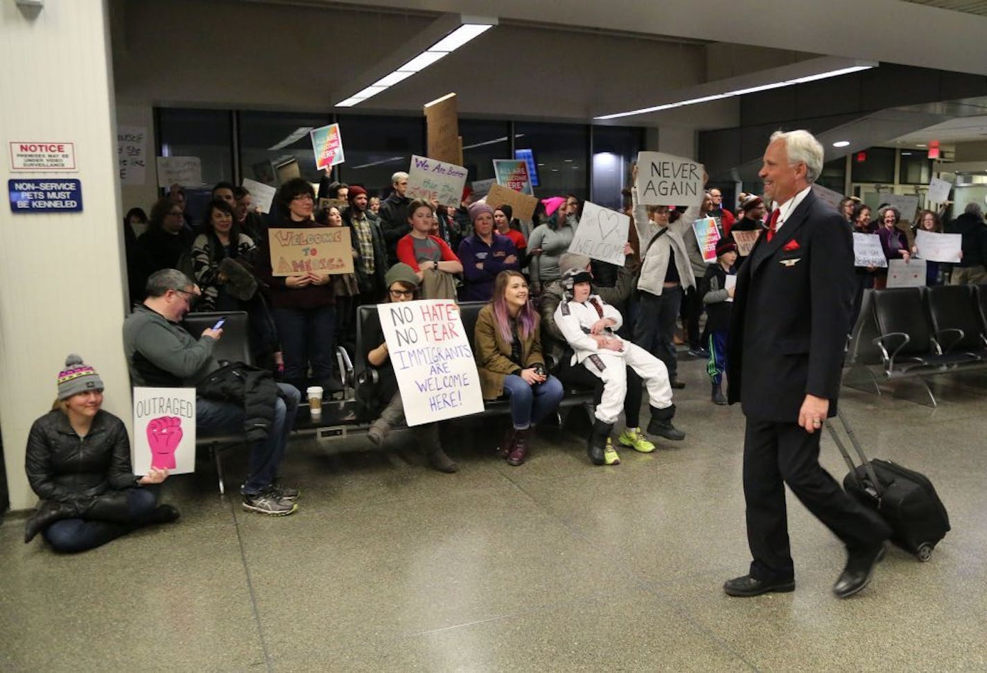 Travelers arriving to MSP at the International gate were greeted by Minnesotans protesting President Trump's executive order halting refugees to the United States from seven Muslim-majority countries.