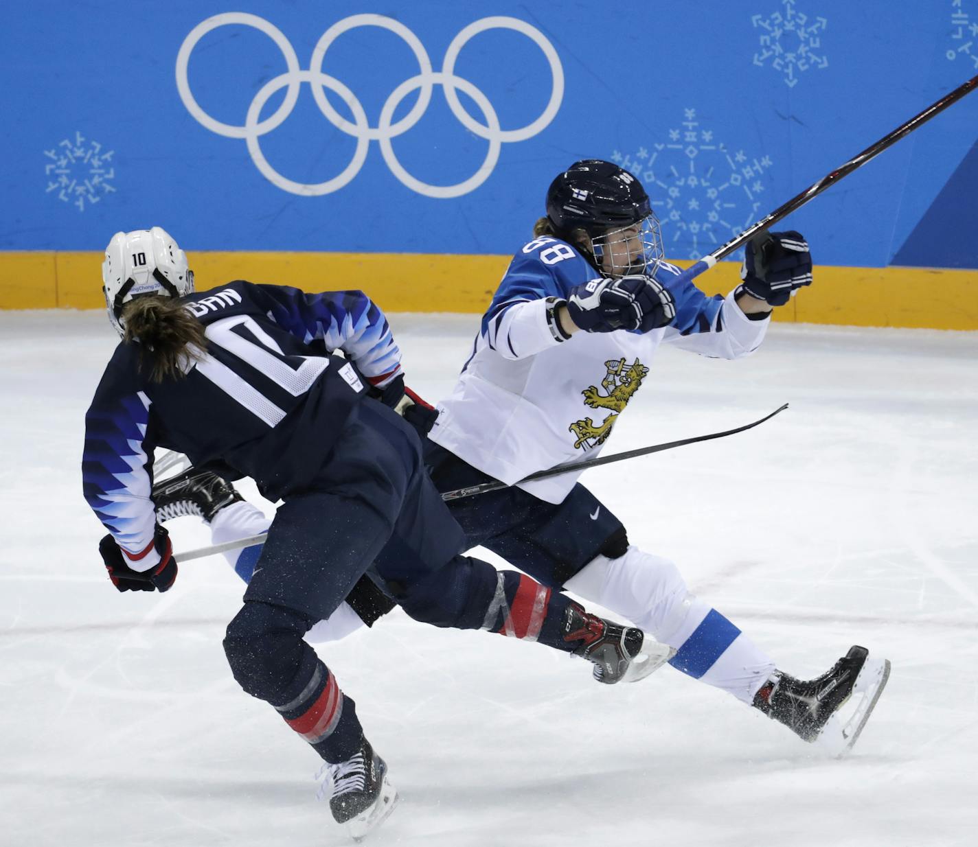 Meghan Duggan (10), of the United States, and Ronja Savolainen, of Finland, collide during the first period of the semifinal round of the women's hockey game at the 2018 Winter Olympics in Gangneung, South Korea, Monday, Feb. 19, 2018. (AP Photo/Julio Cortez)