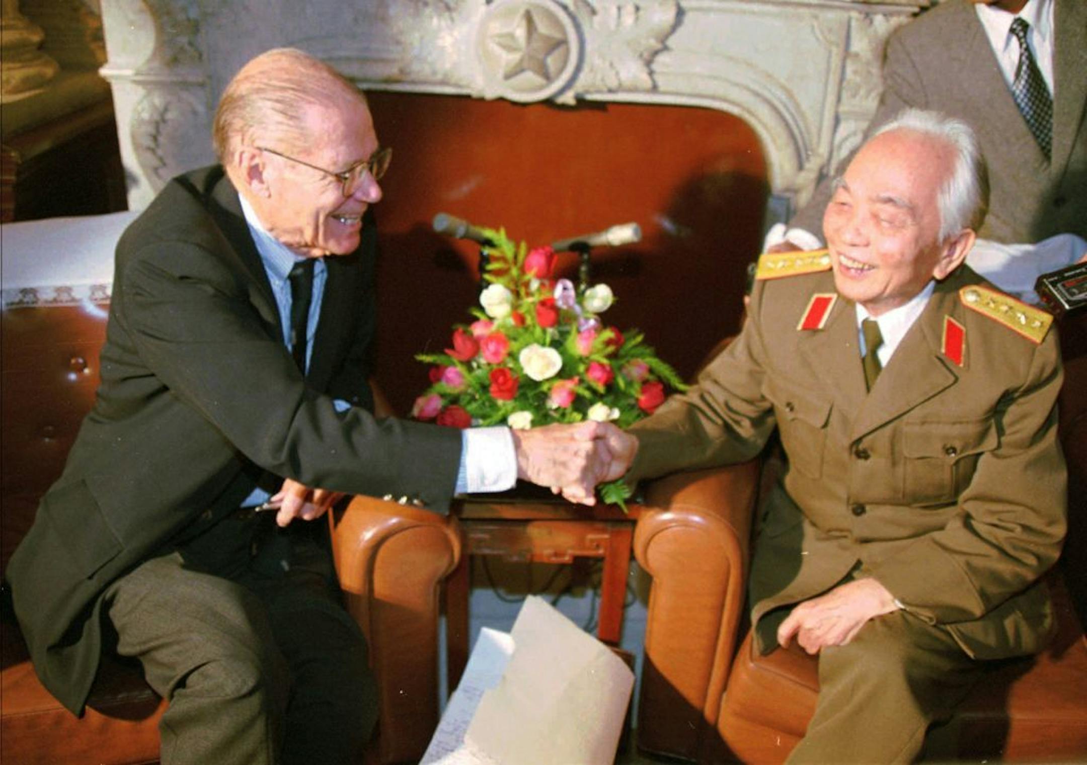 FILE - In this Thursday, Nov. 9, 1995 file photo, Vietnamese Gen. Vo Nguyen Giap, right, shakes hands with former U.S. Secretary of Defense Robert McNamara during a meeting in Hanoi, Vietnam.