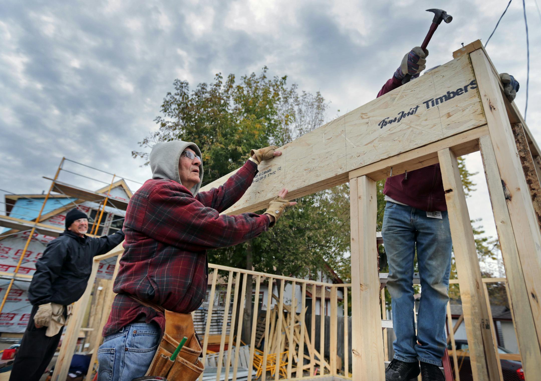 Habitat for Humanity, renowned for building new houses, is moving into the fixer upper business. Here, Vince Kinney (center) works on a new house garage at 2700 Morgan Ave. N in Minneapolis Tuesday afternoon. ] brian.peterson@startribune.com
Minneapolis, MN 10/25/16