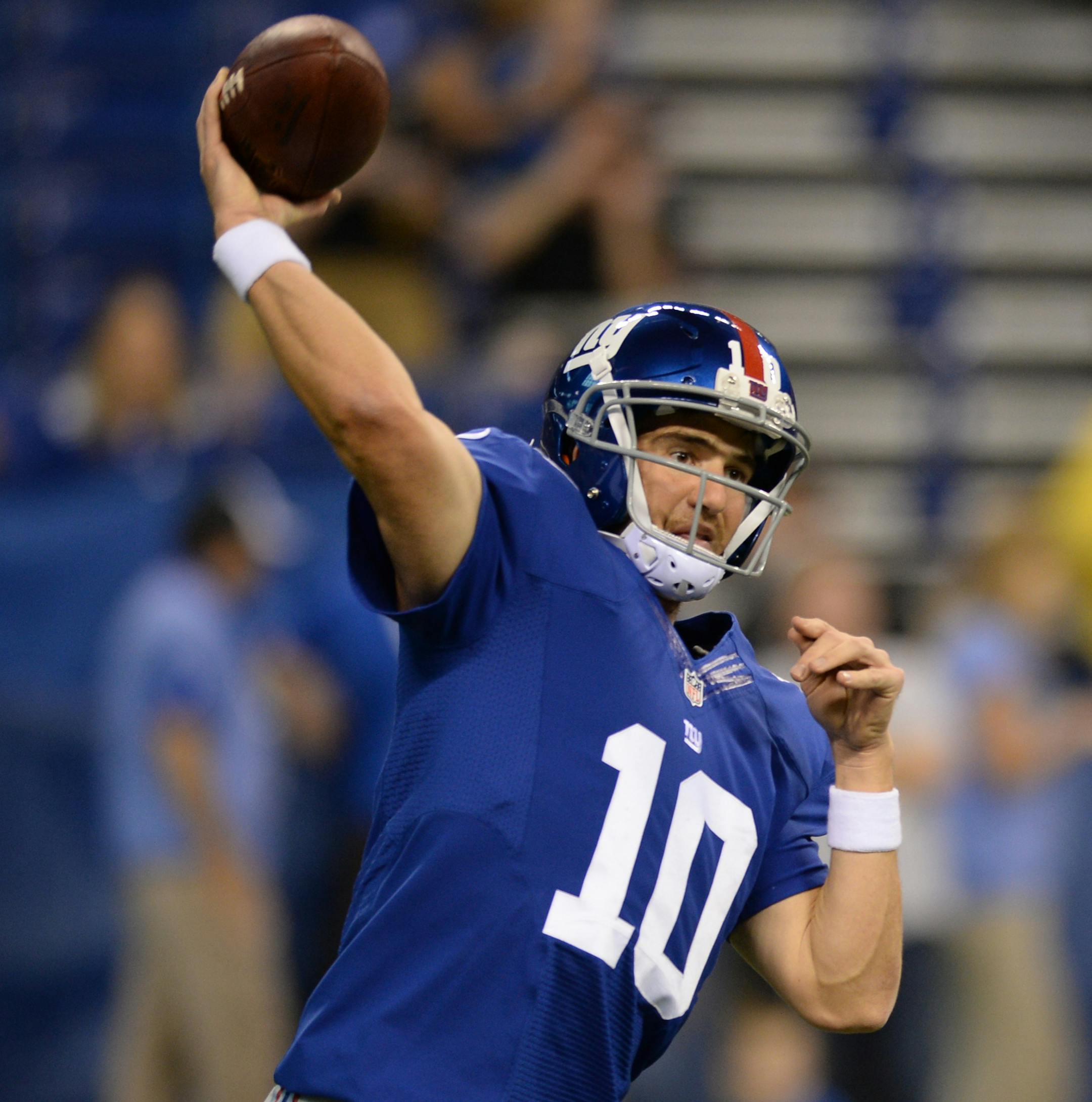 New York Giants quarterback Eli Manning (10) throws before the start of an NFL preseason football game between the New York Giants and the Indianapolis Colts Saturday, Aug. 16, 2014, in Indianapolis. (AP Photo/Chris Howell) ORG XMIT: NAF1
