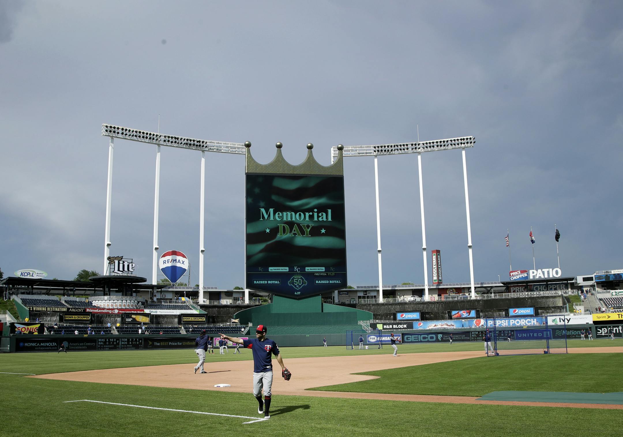 Minnesota Twins second baseman Brian Dozier points to fans before a baseball game against the Kansas City Royals at Kauffman Stadium in Kansas City, Mo., Monday, May 28, 2018. (AP Photo/Orlin Wagner)