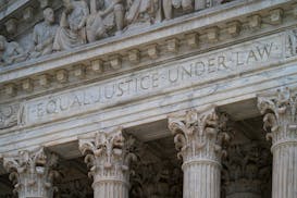 The west facade of the Supreme Court Building bears the motto "Equal Justice Under Law," in Washington.