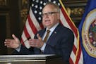 Gov. Tim Walz praised the sweeping new law as a "visionary piece of legislation" that was "many tragedies and heartbreaks in the making."