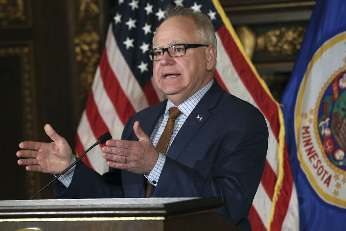 Gov. Tim Walz praised the sweeping new law as a "visionary piece of legislation" that was "many tragedies and heartbreaks in the making."