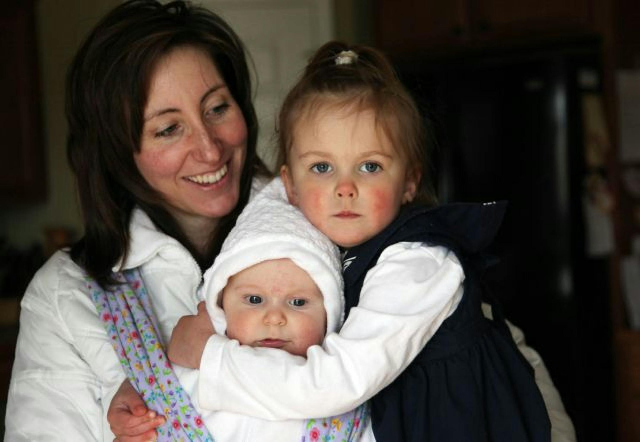 RENEE JONES SCHNEIDER � reneejones@startribune.com Montrose Minn. � 5/12/10 - Dannette Lund wanted to have a natural child birth with both of her children, now aged 2 and 2 months. But for the first one she had c-section. The second one would have been c-section as well, but she took matters into her own hands. Birth in America is rarely the natural event she wanted. But changing that -- and reducing costs in health care -- will be difficult. - IN THIS PHOTO - Dannette Lund held her two daughter